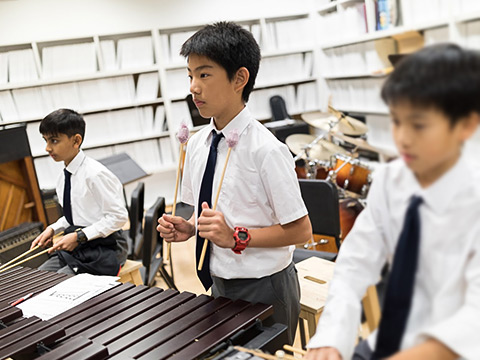 Students playing xylophone